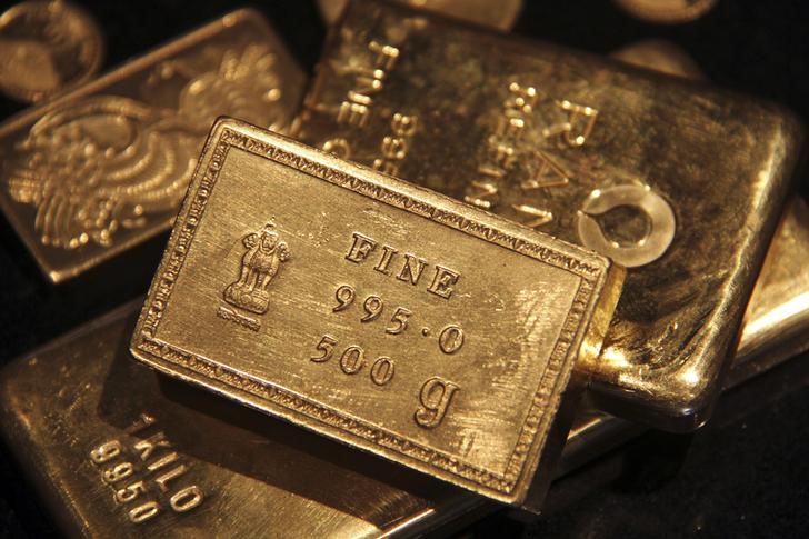 Gold at 5-month low, socked by U.S. yields and dollar