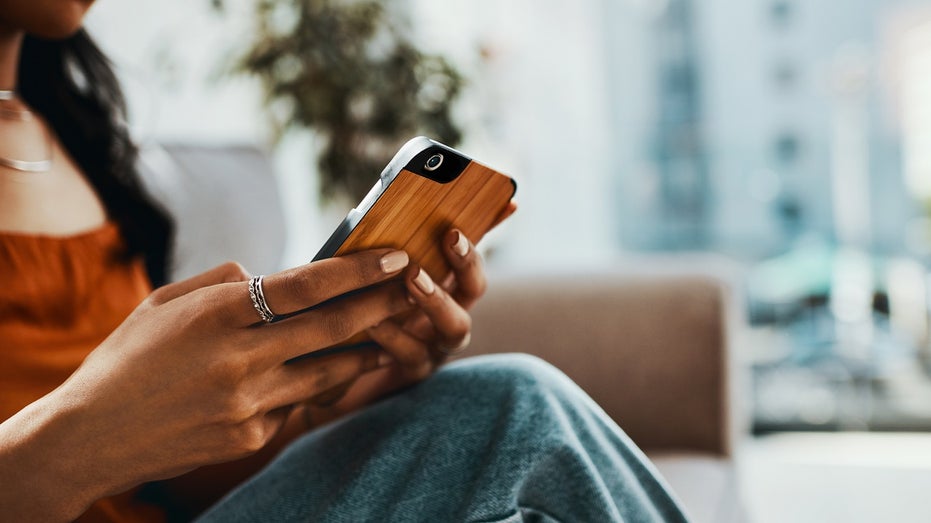 woman holding phone