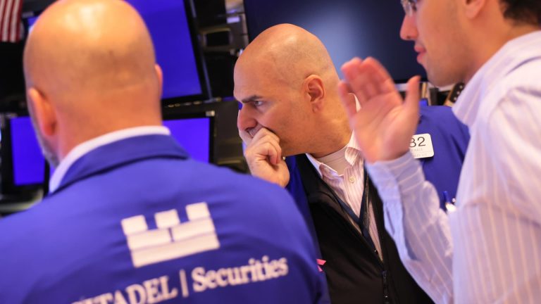 Stock futures are little changed as Wall Street shifts focus back to path of interest rates